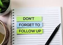 Notebook with sticky notes reading don't forget to follow up
