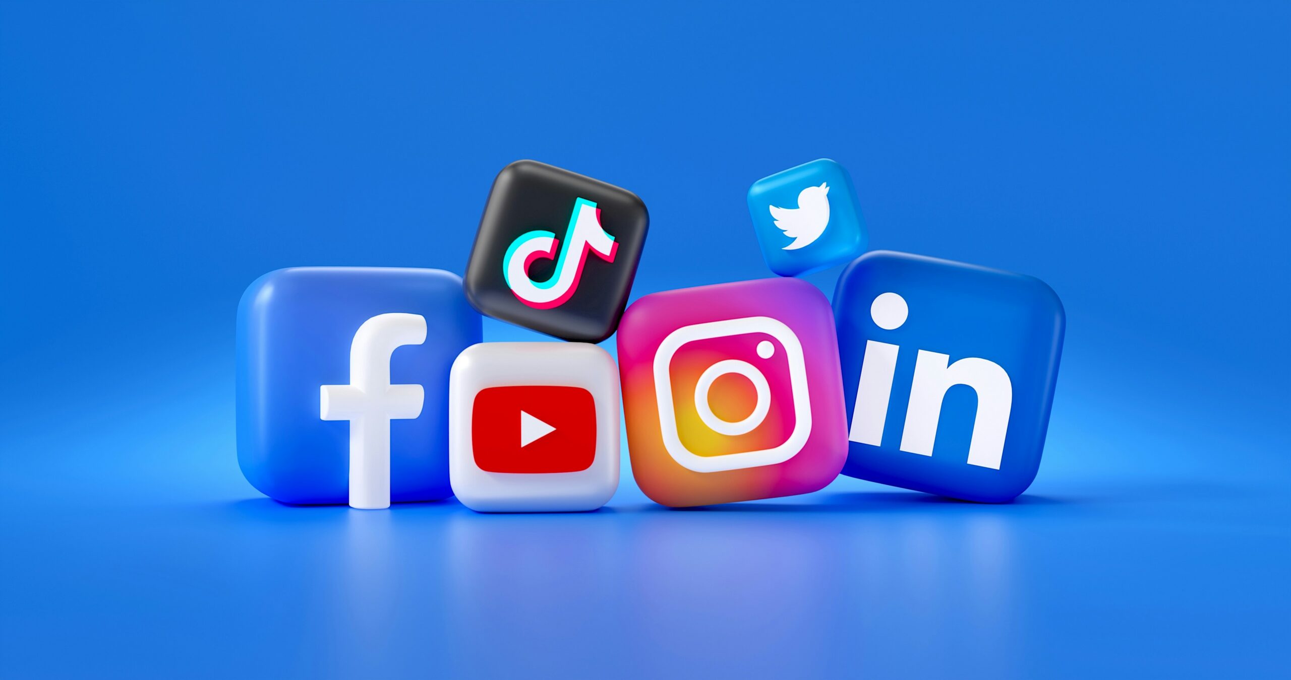 3D icons for Facebook, YouTube, TikTok, Instagram, Twitter, and LinkedIn on a blue background